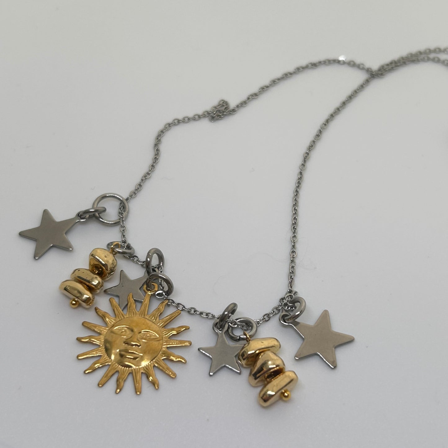 Gold sun silver toned necklace