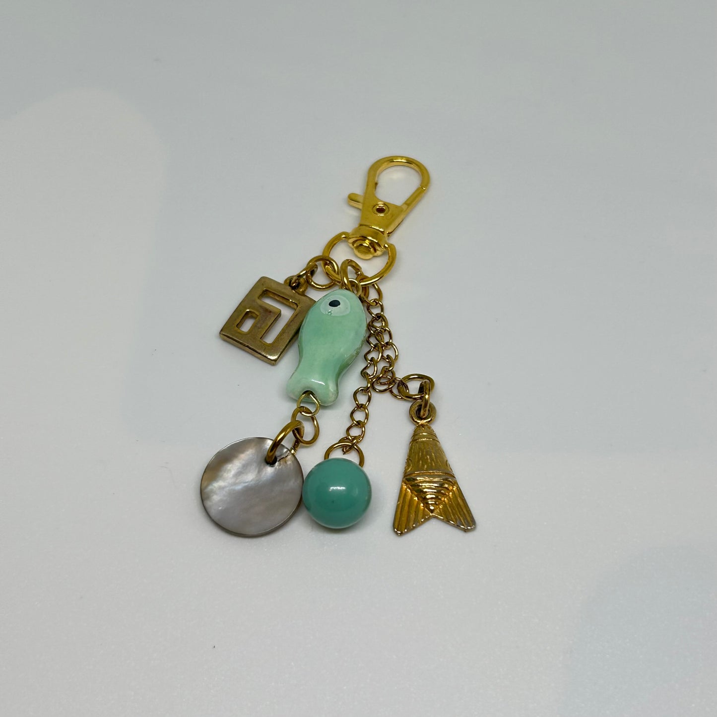 Teal ceramic fish and charm keyring