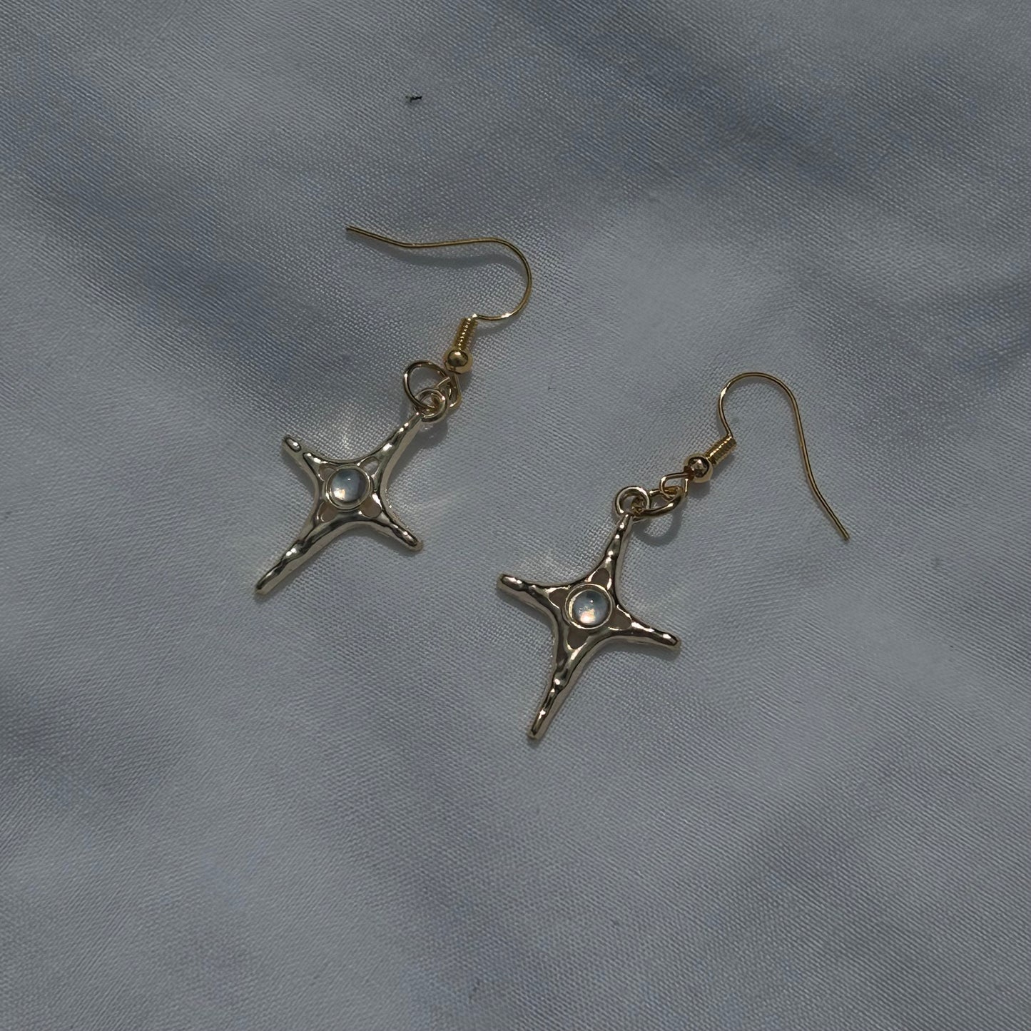 Constellation star in gold earrings