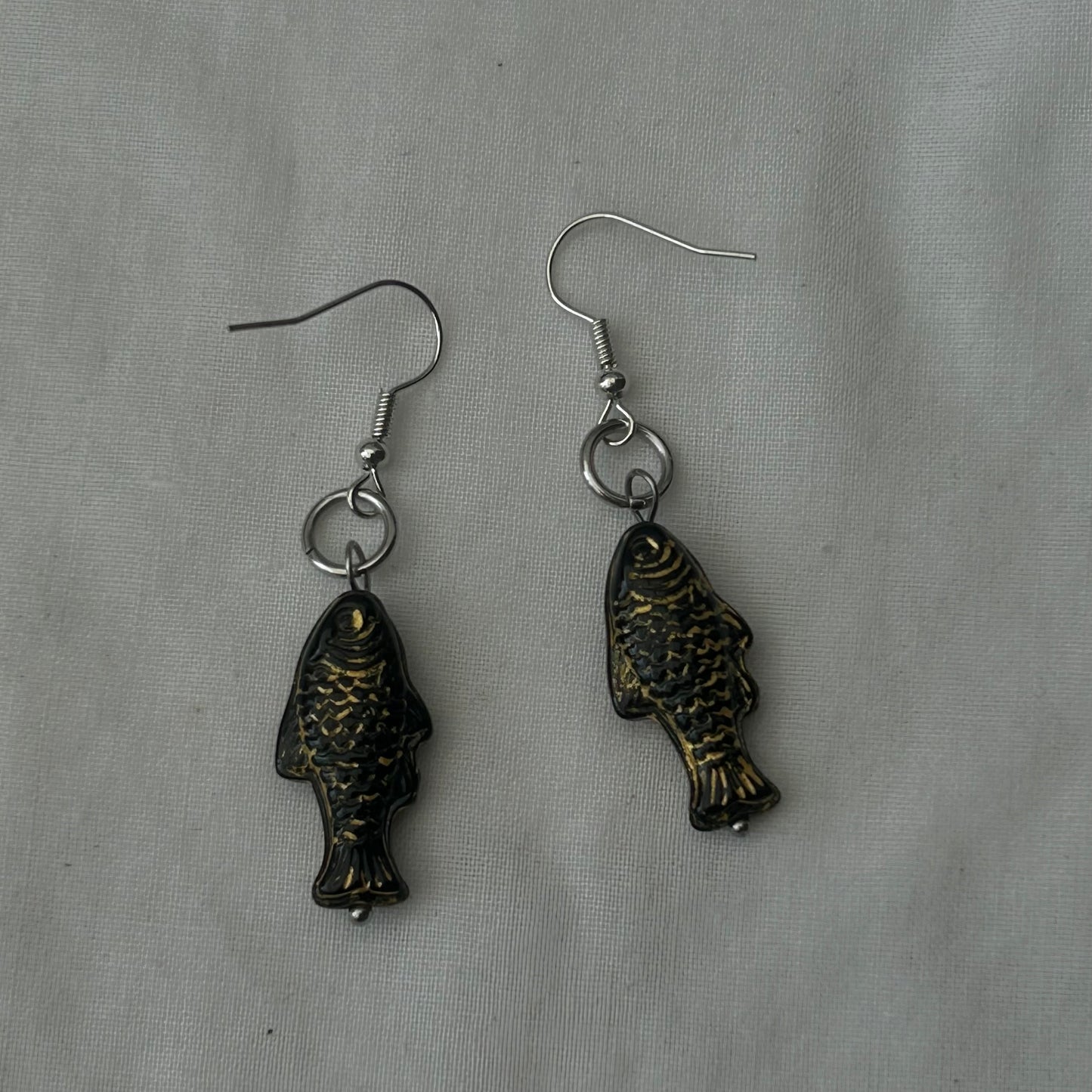 Gold on black fish earrings