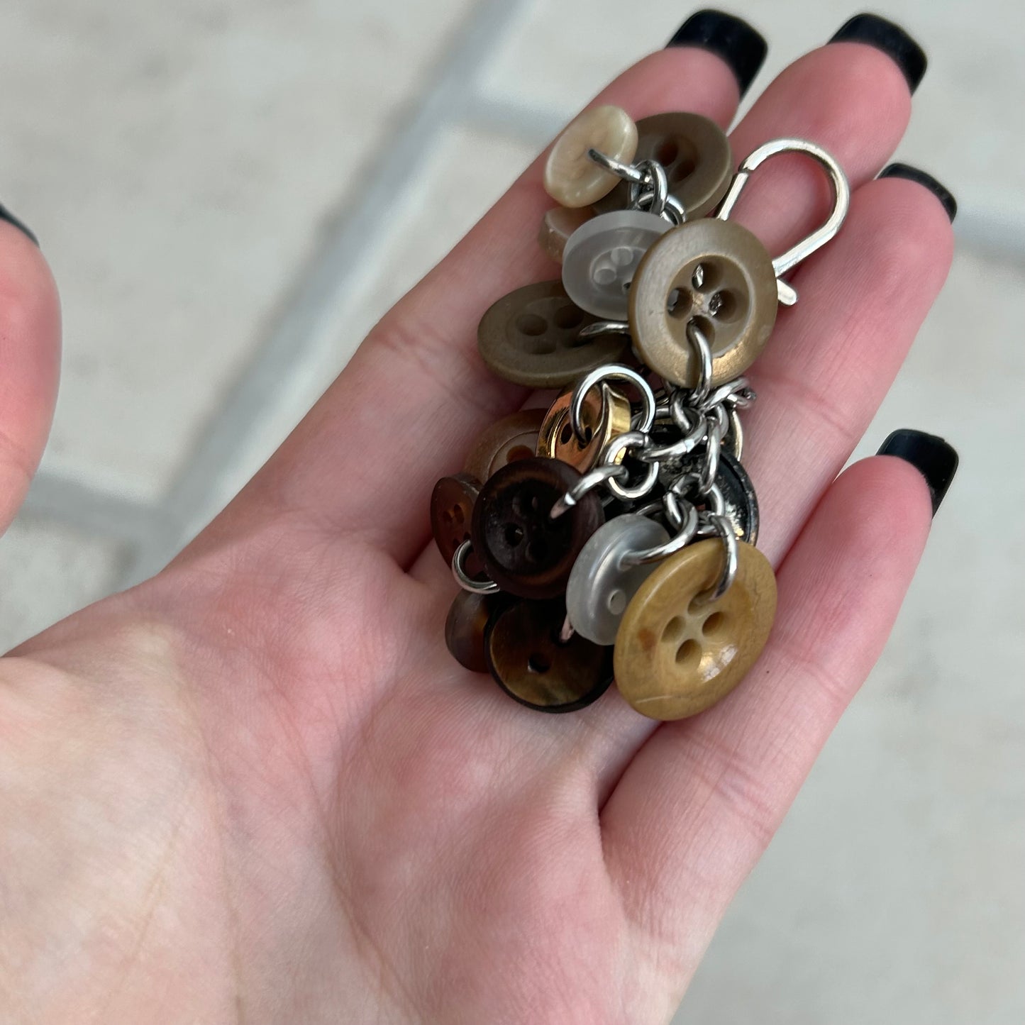 Brown button cluster keyring