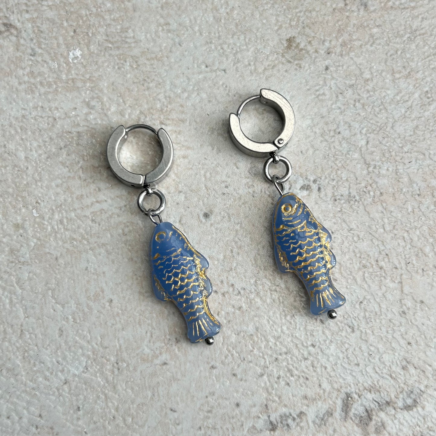 Gold on light blue fish earrings