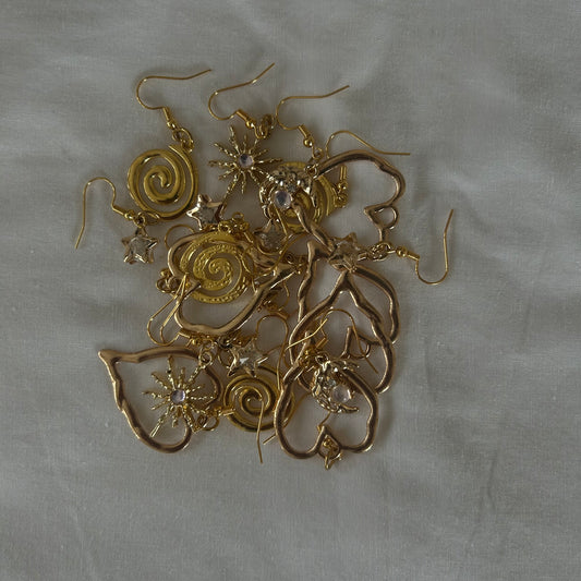 gold tones mystery earrings