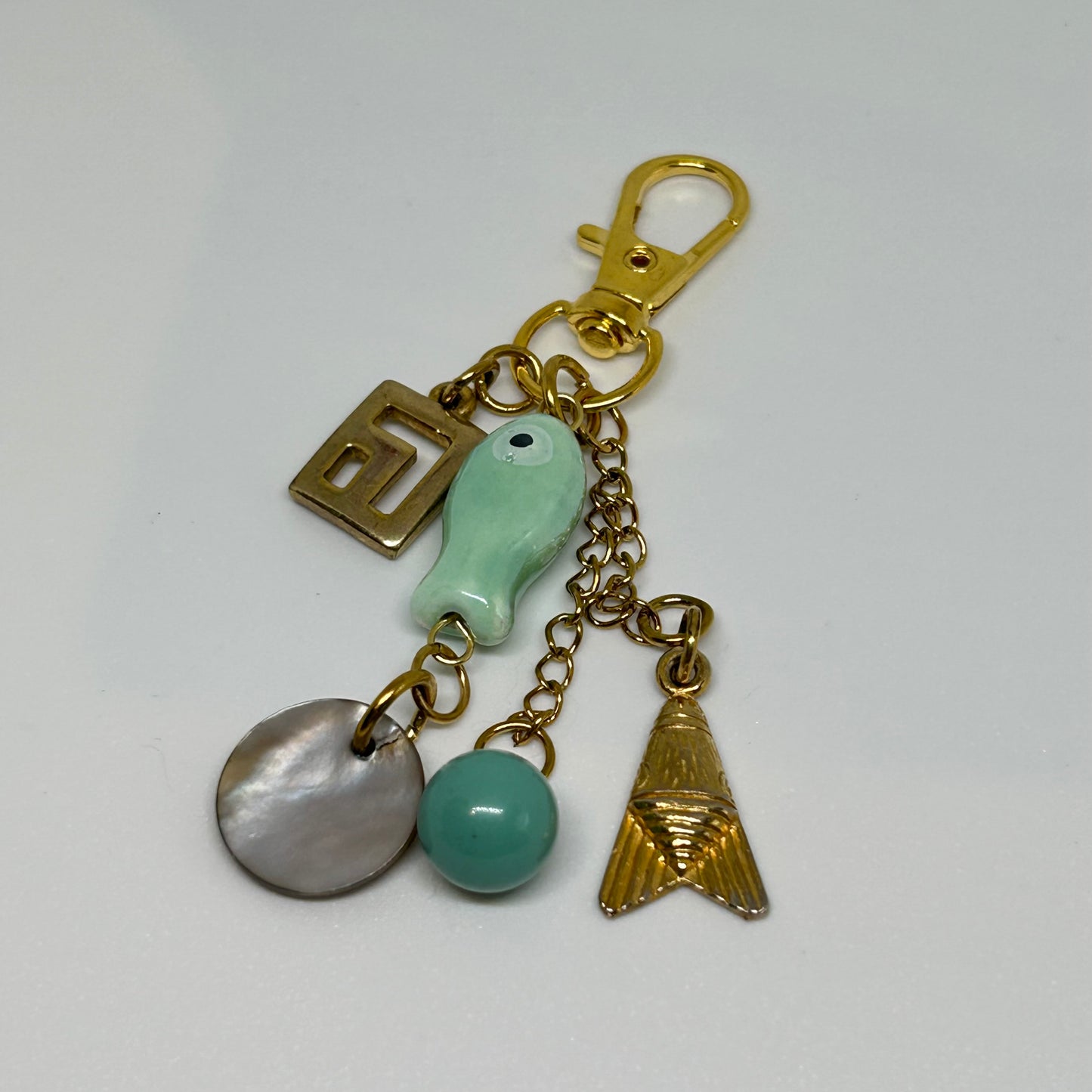 Teal ceramic fish and charm keyring