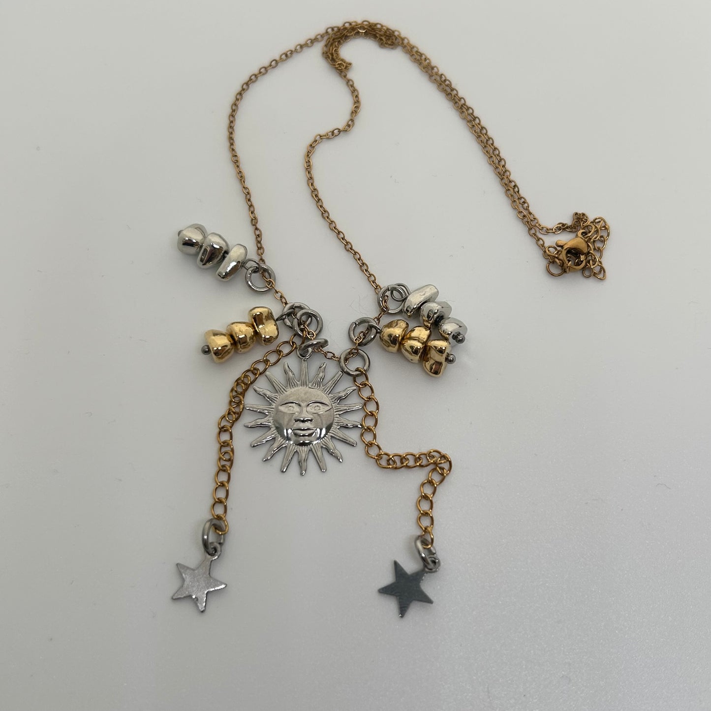 Silver sun mixed metal necklace