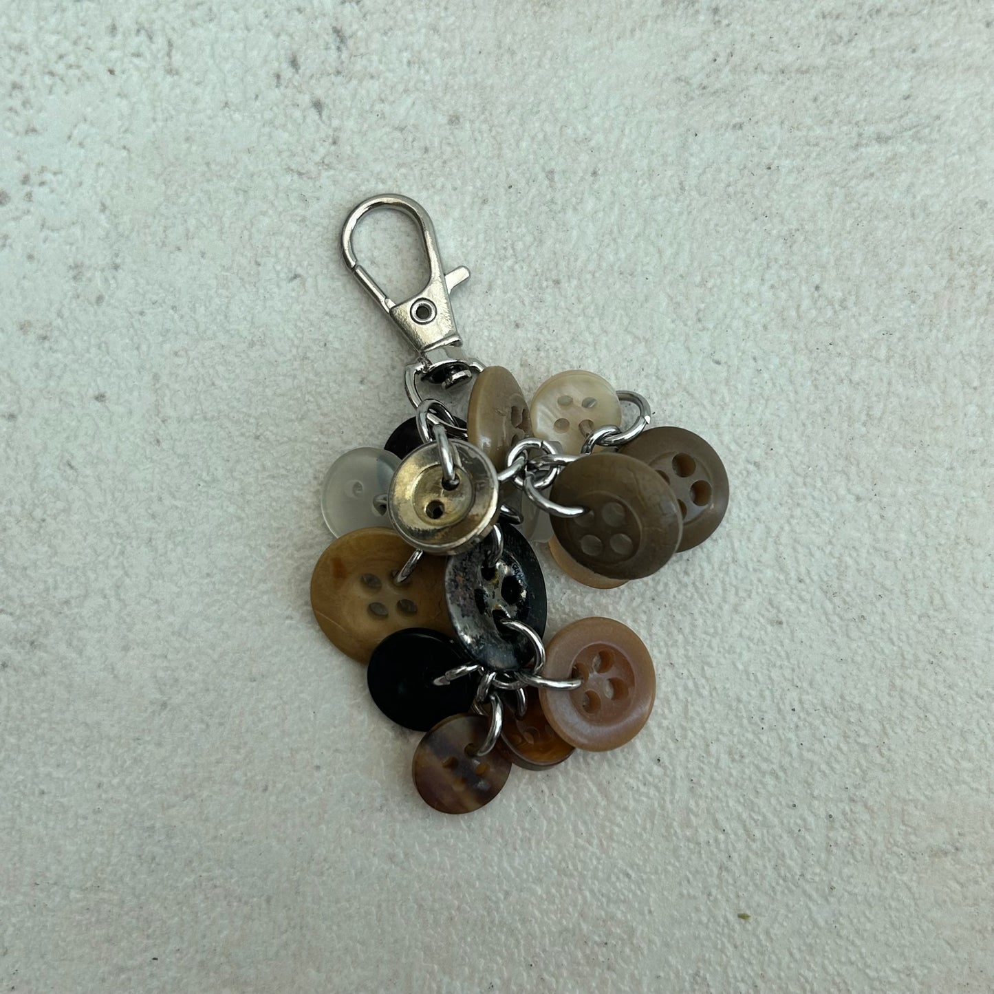 Brown button cluster keyring
