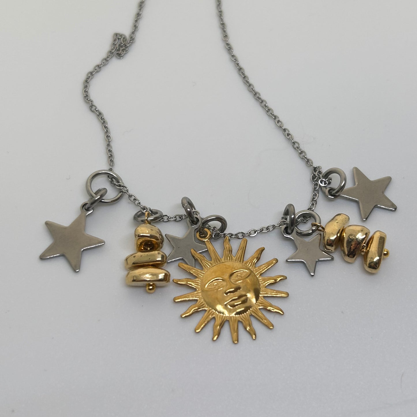 Gold sun silver toned necklace