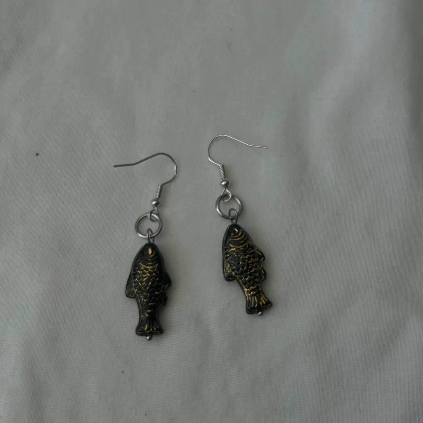 Gold on black fish earrings