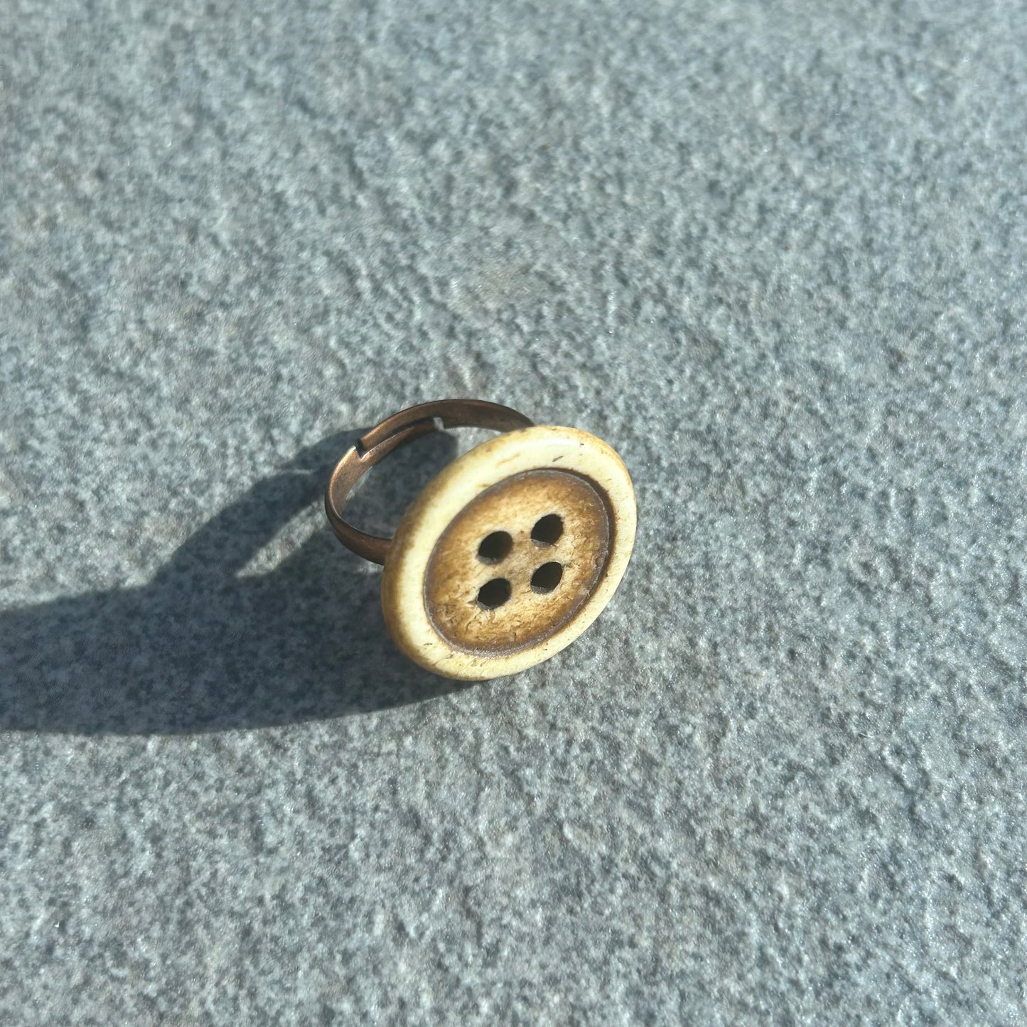 Brown button ring