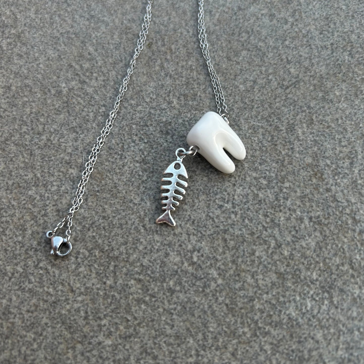 Rotting fish necklace