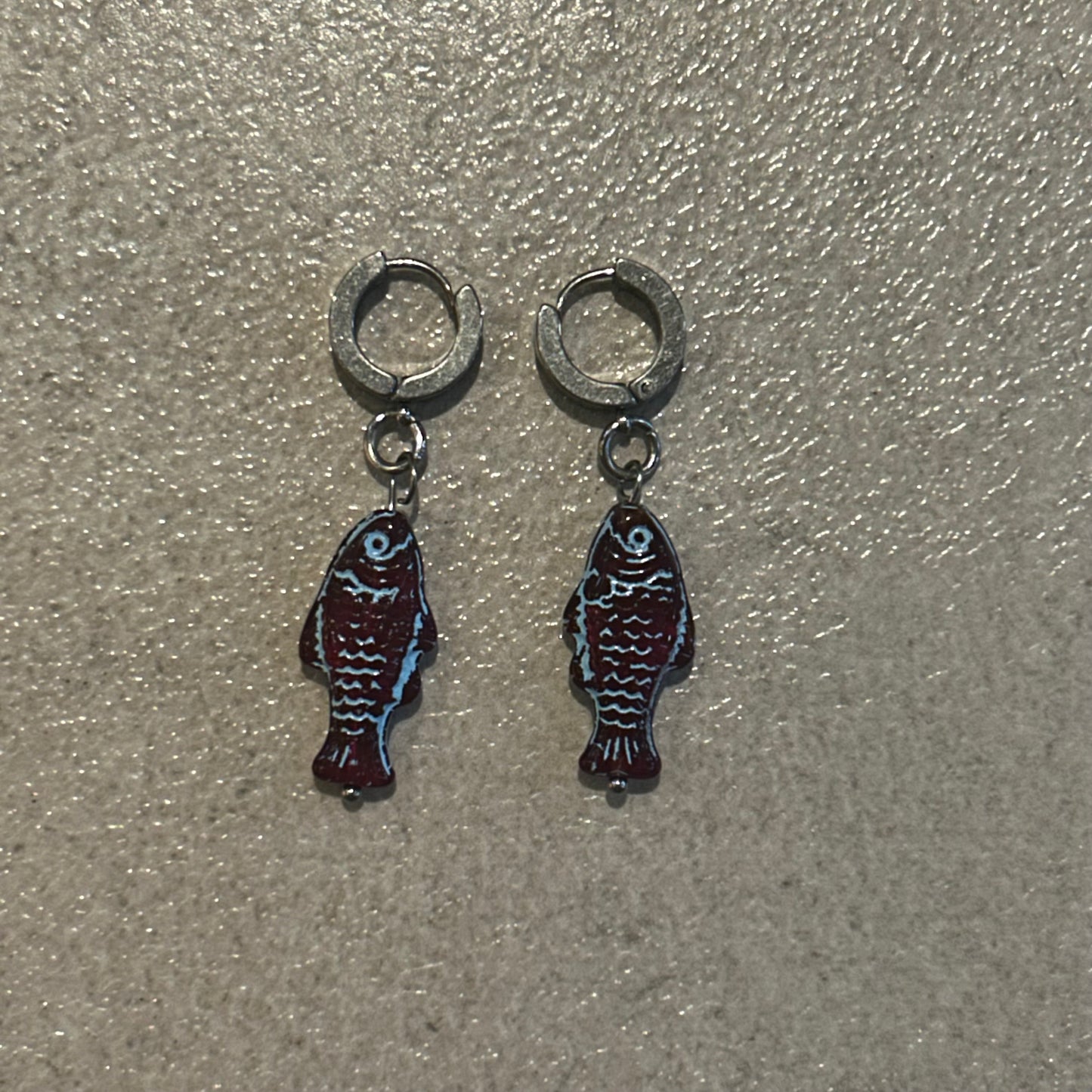 Blue on burgundy fish earrings