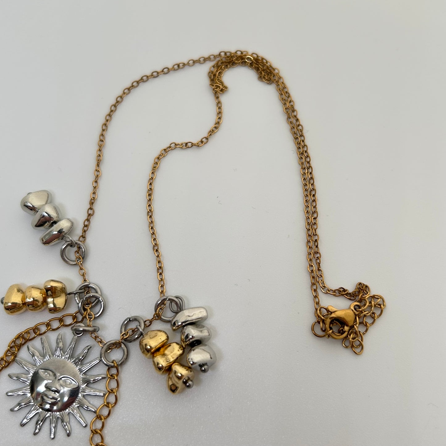 Silver sun mixed metal necklace
