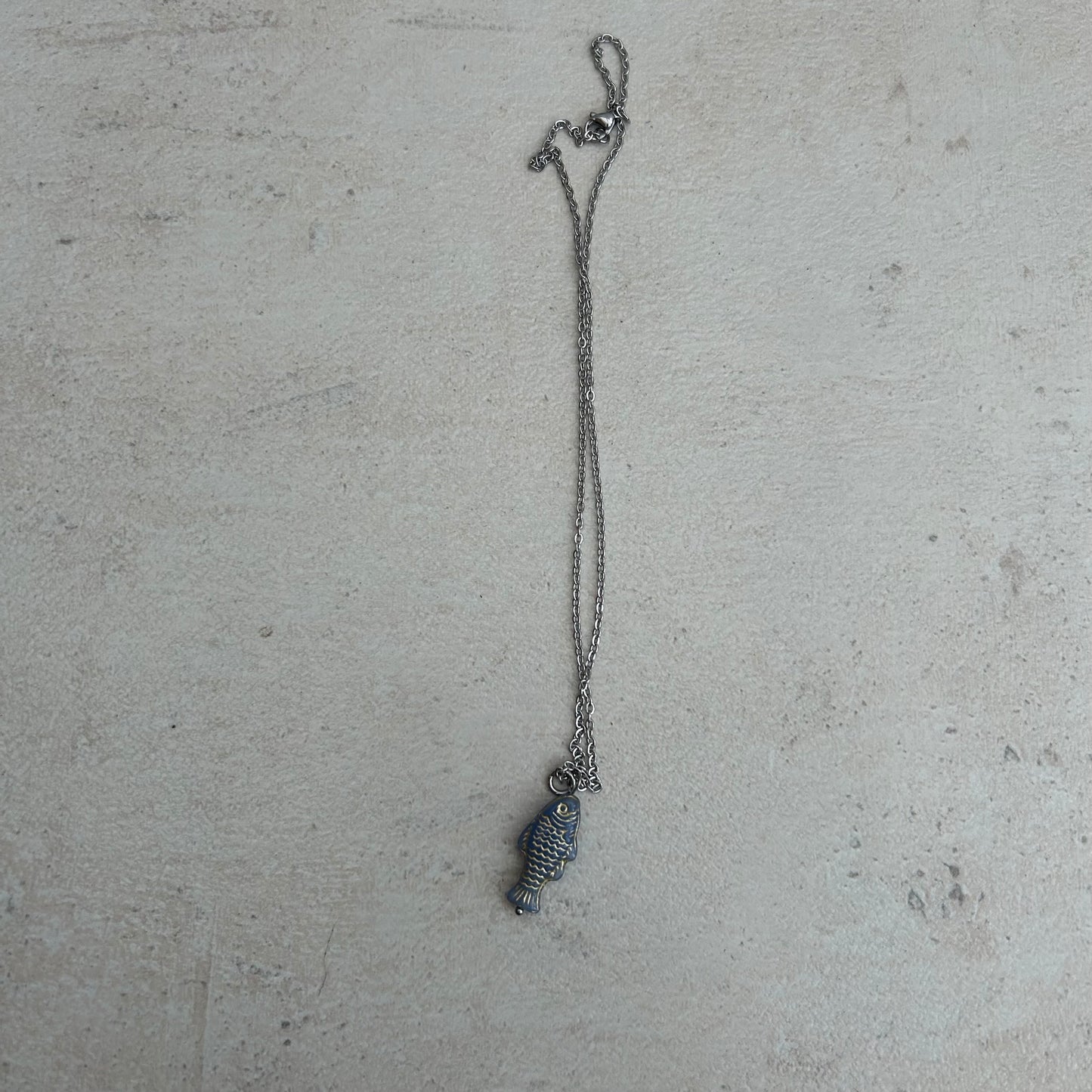 Gold on grey fish necklace