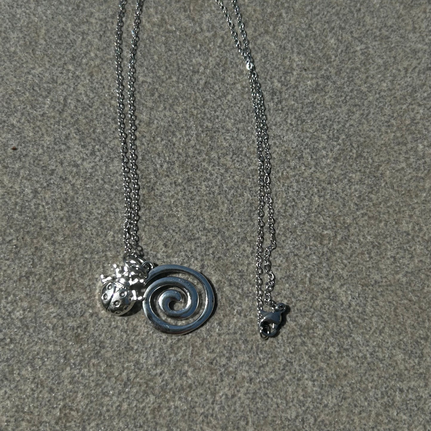 Spiral charm necklace
