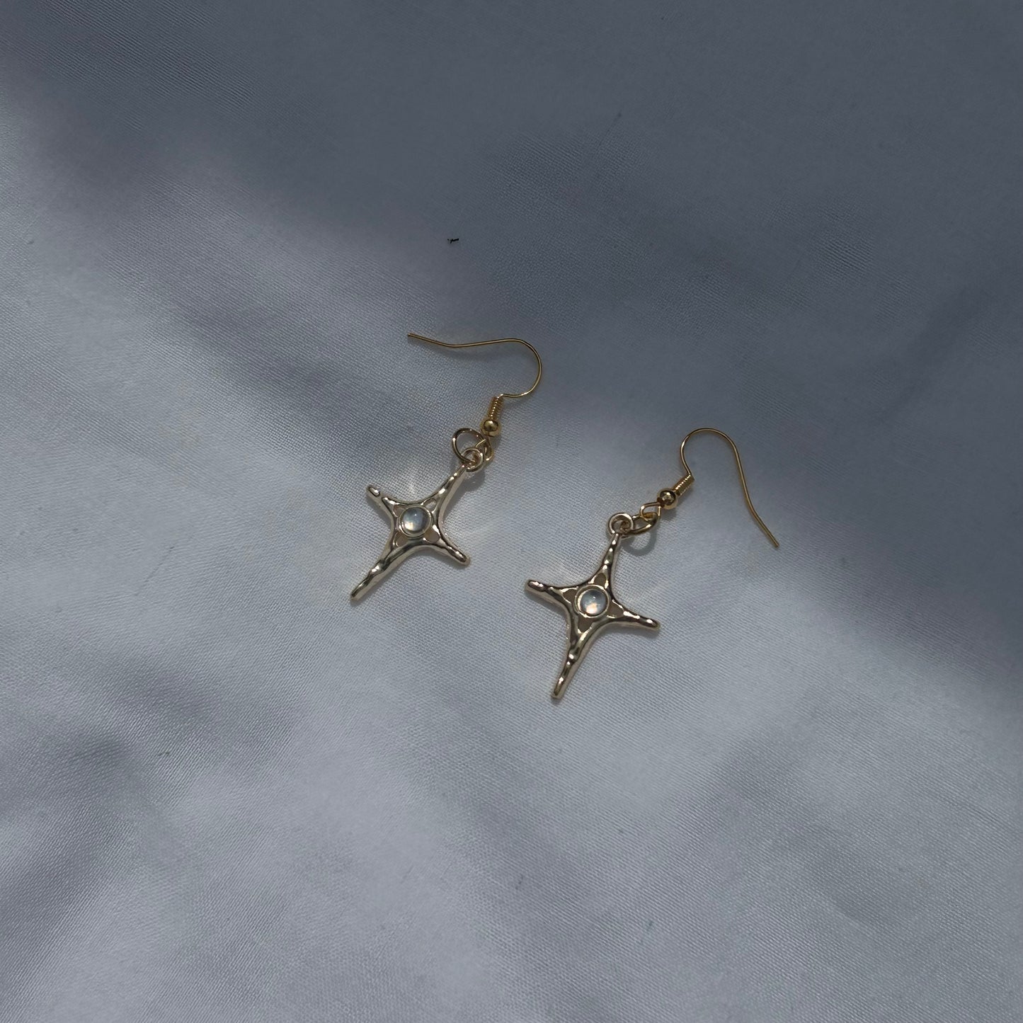 Constellation star in gold earrings