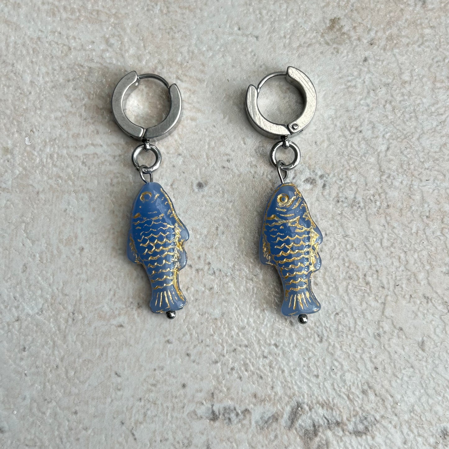 Gold on light blue fish earrings