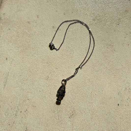 Gold on transparent dark blue fish necklace