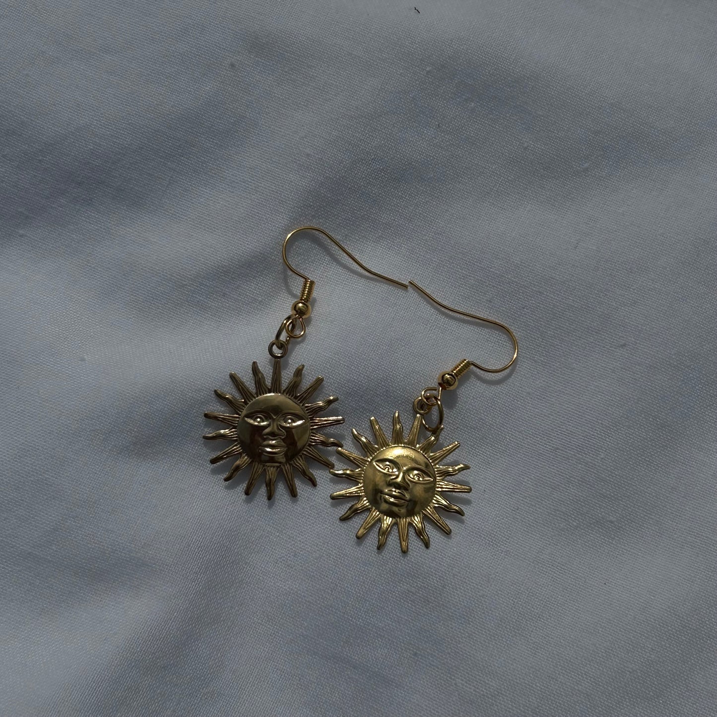 Gold sun earrings