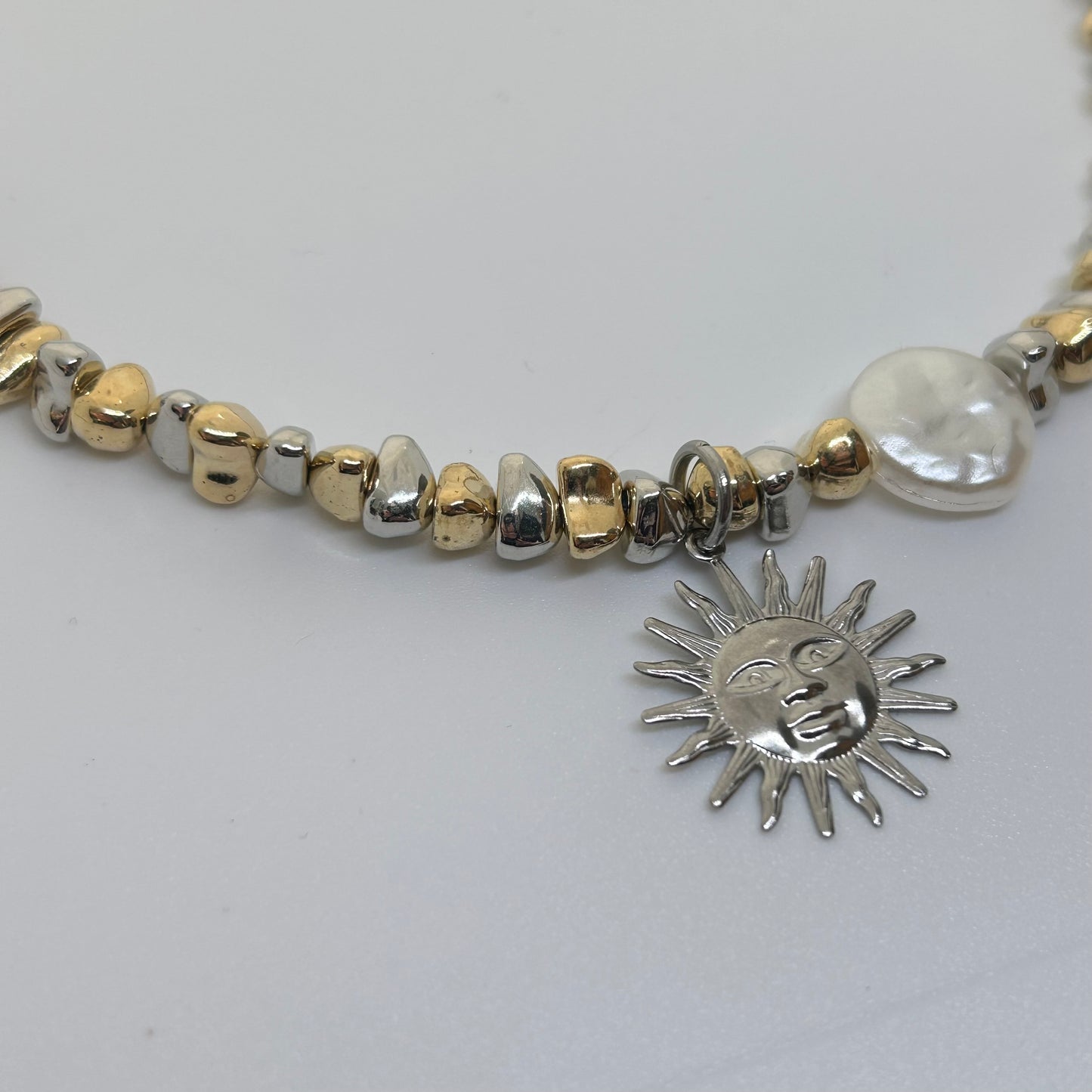 Silver sun mixed metal necklace