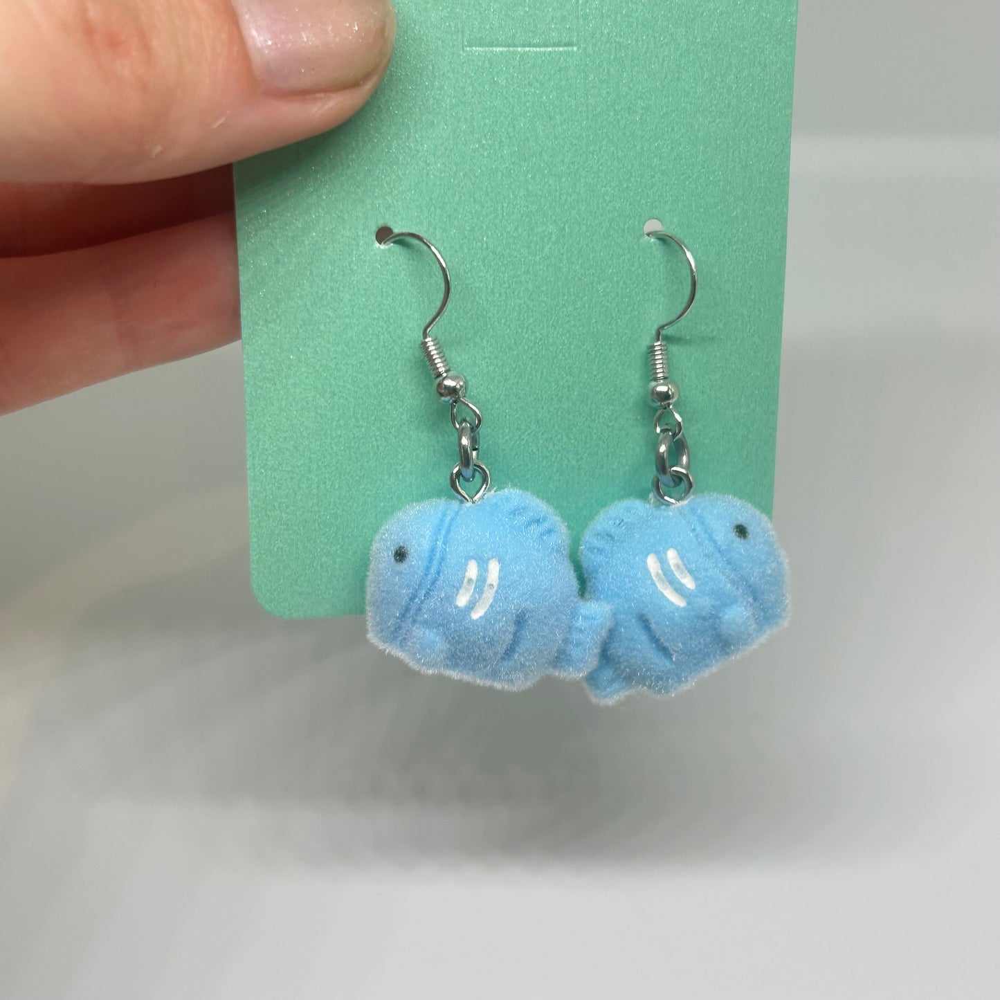 blue fluffy fish earrings