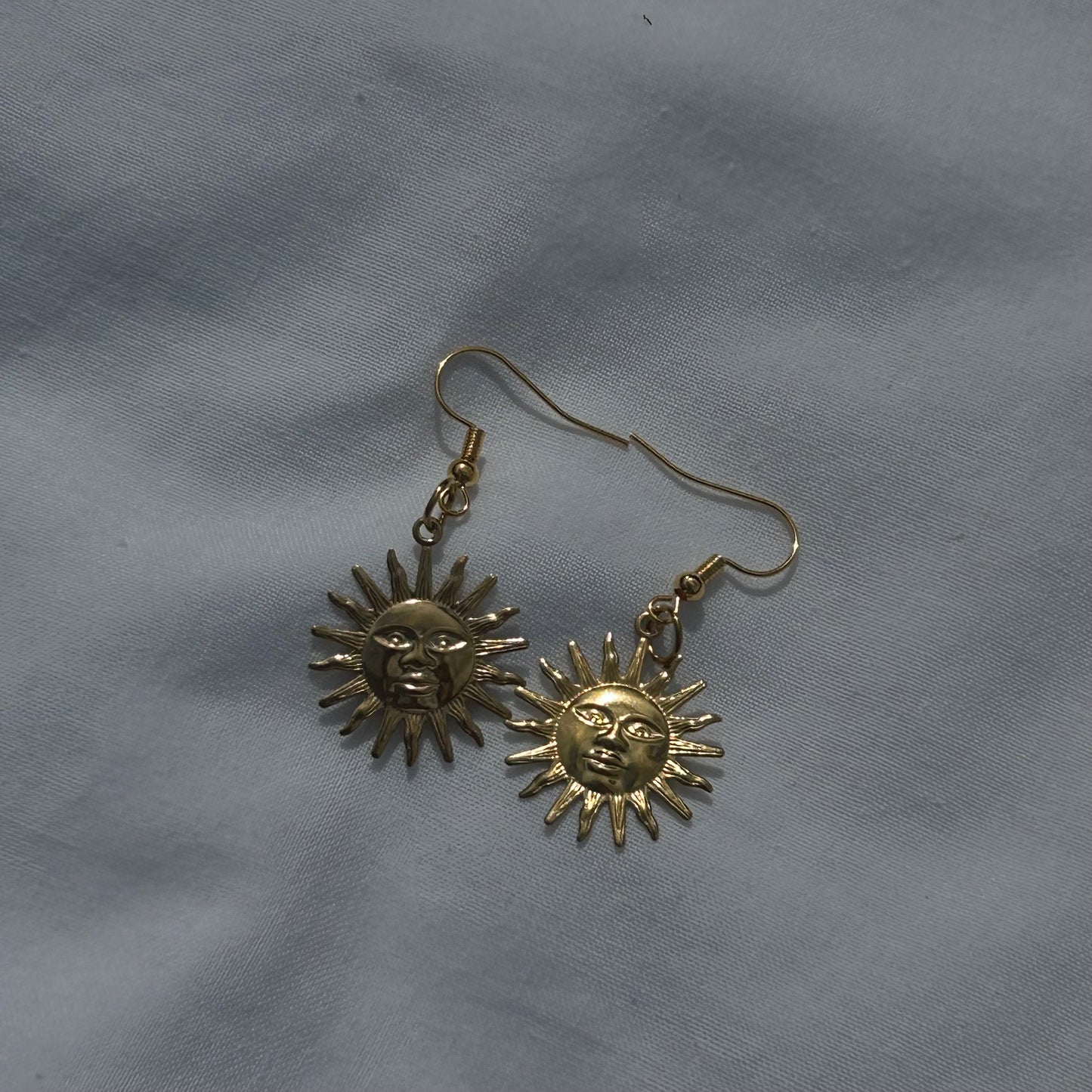 Gold sun earrings