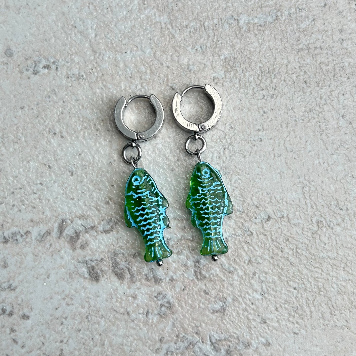 Transparent green fish earrings