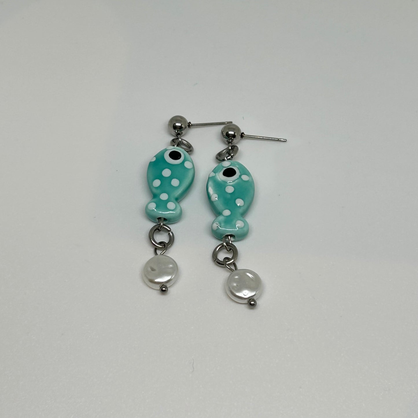 teal polka dot ceramic fish earrings