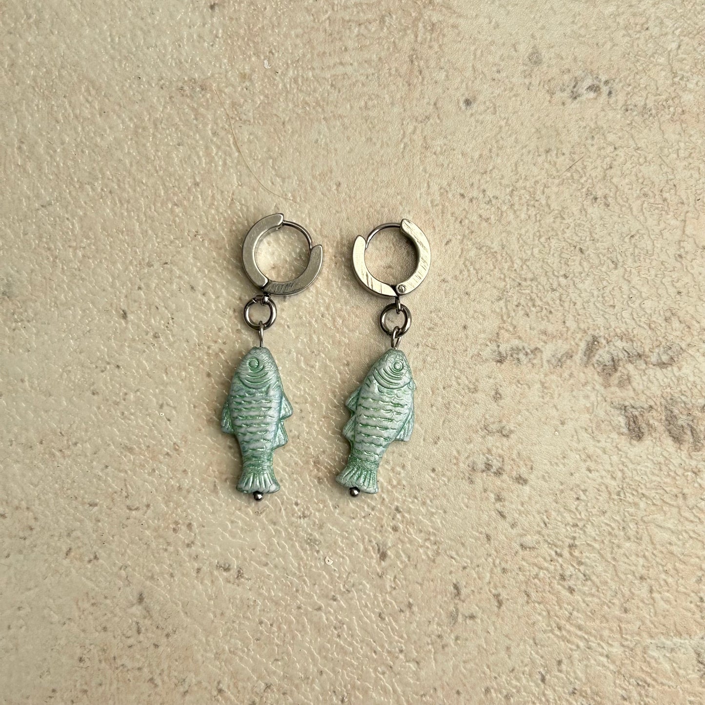 Teal fish earrings
