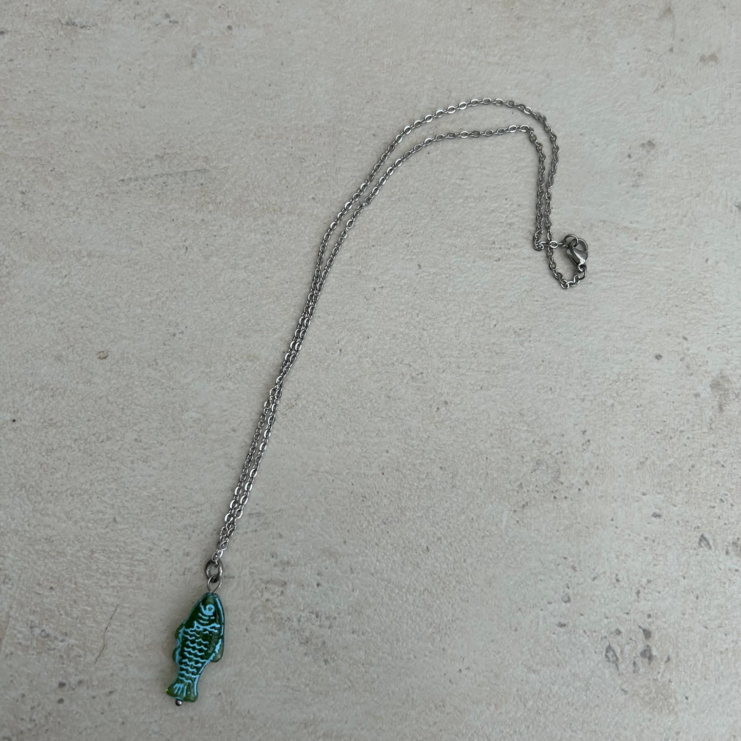 Blue on green fish necklace