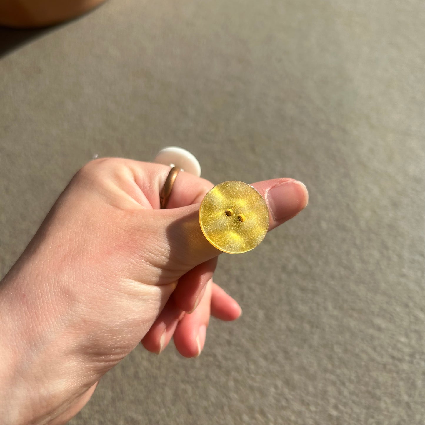 Yellow button ring