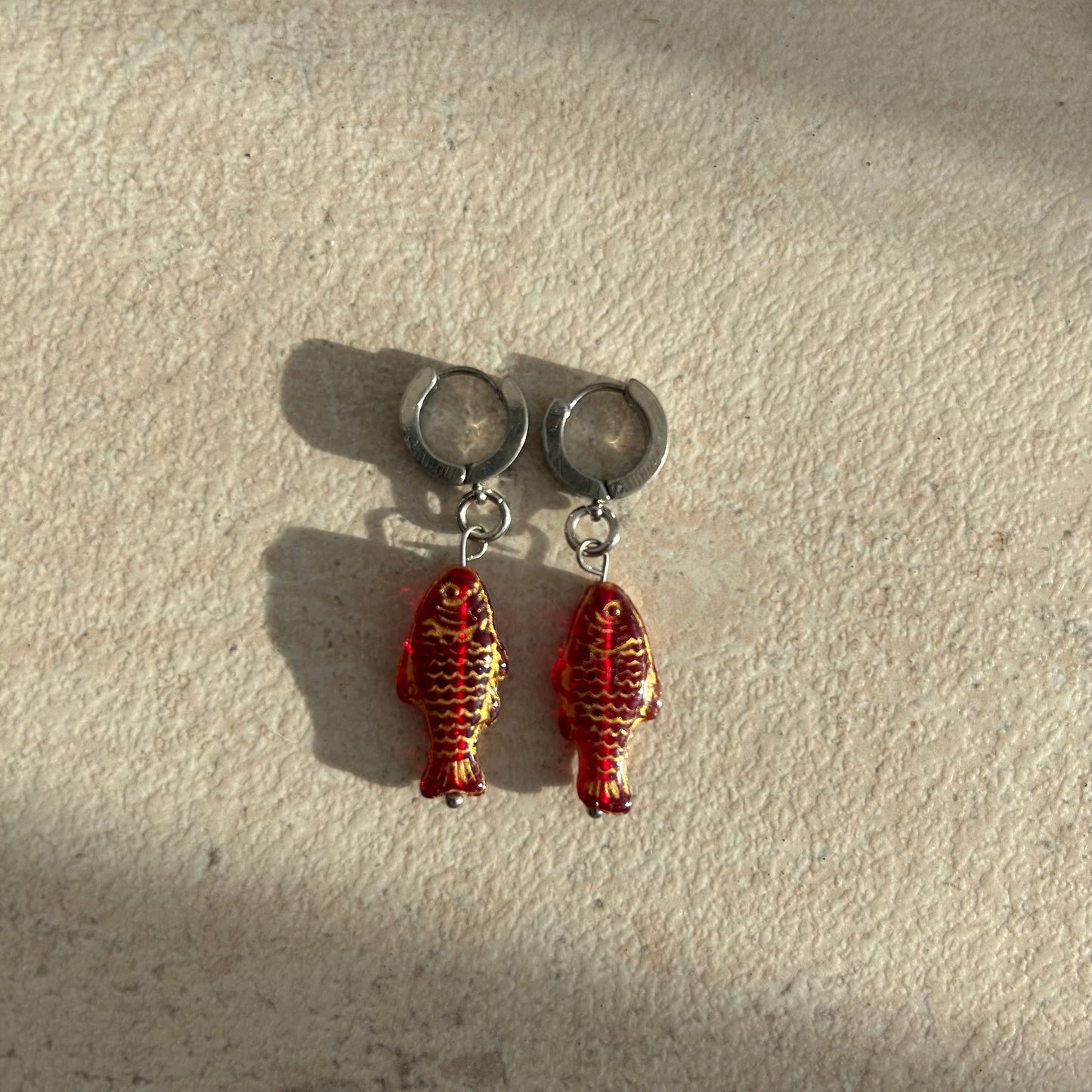 gold on red fish earrings