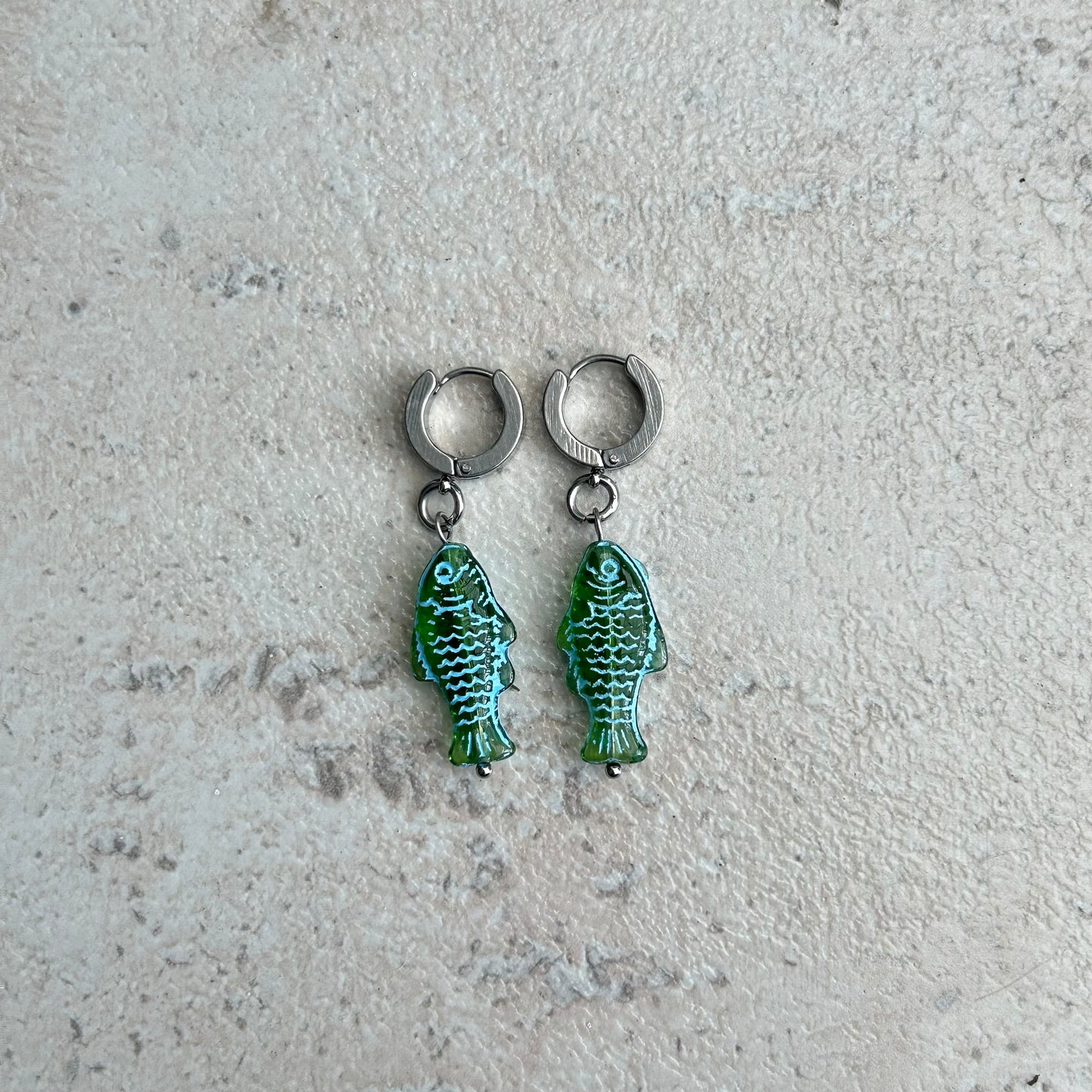 Transparent green fish earrings