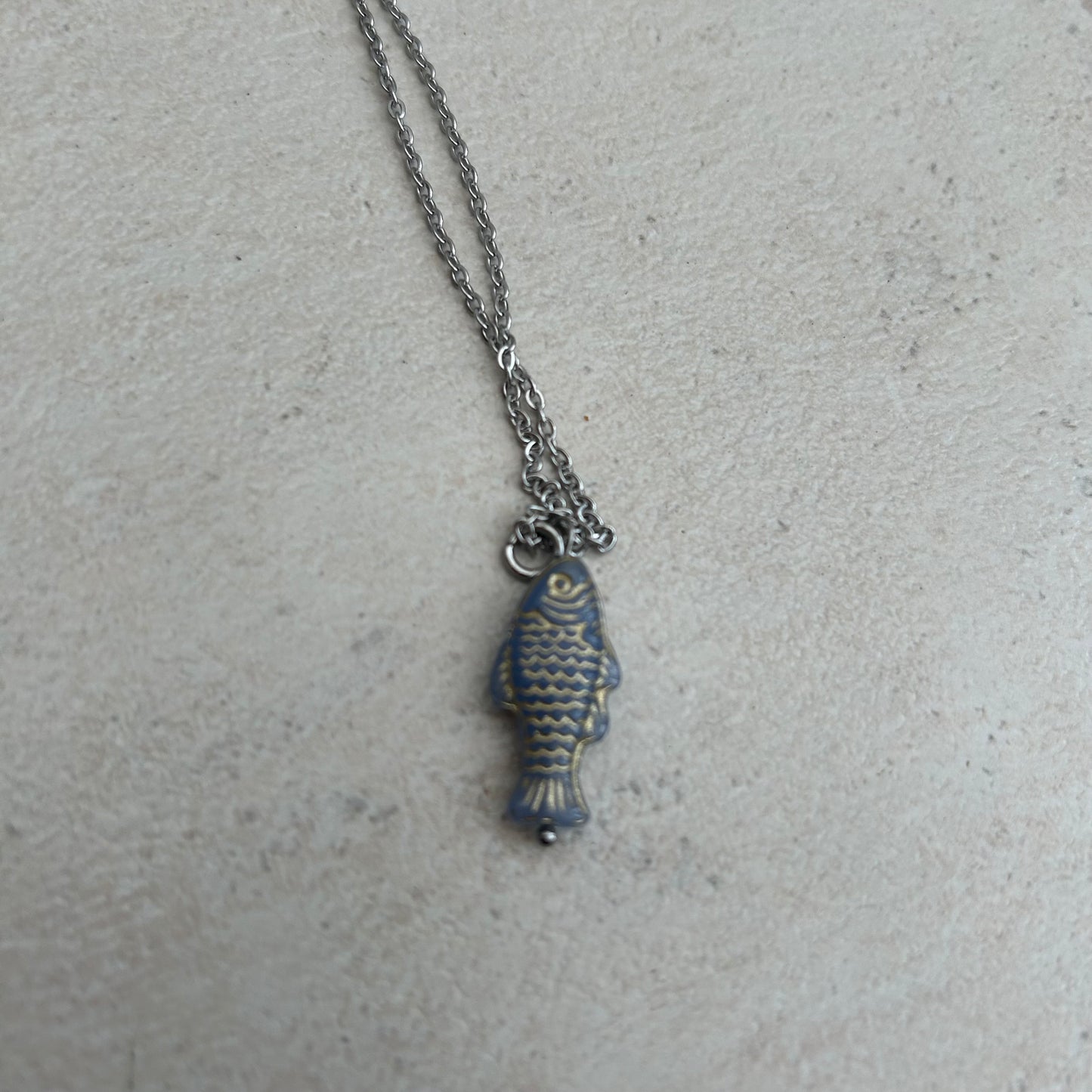 Gold on grey fish necklace