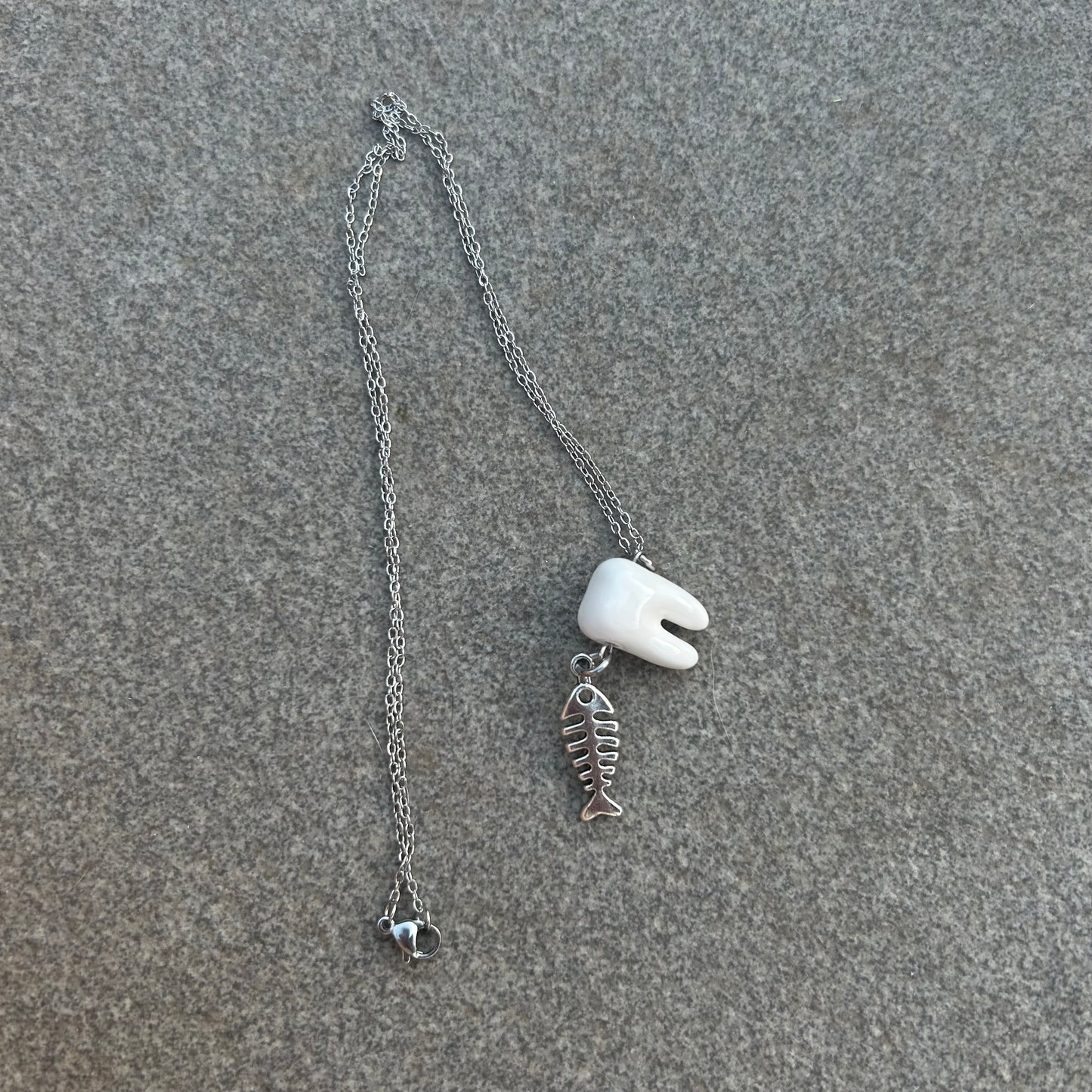 Rotting fish necklace